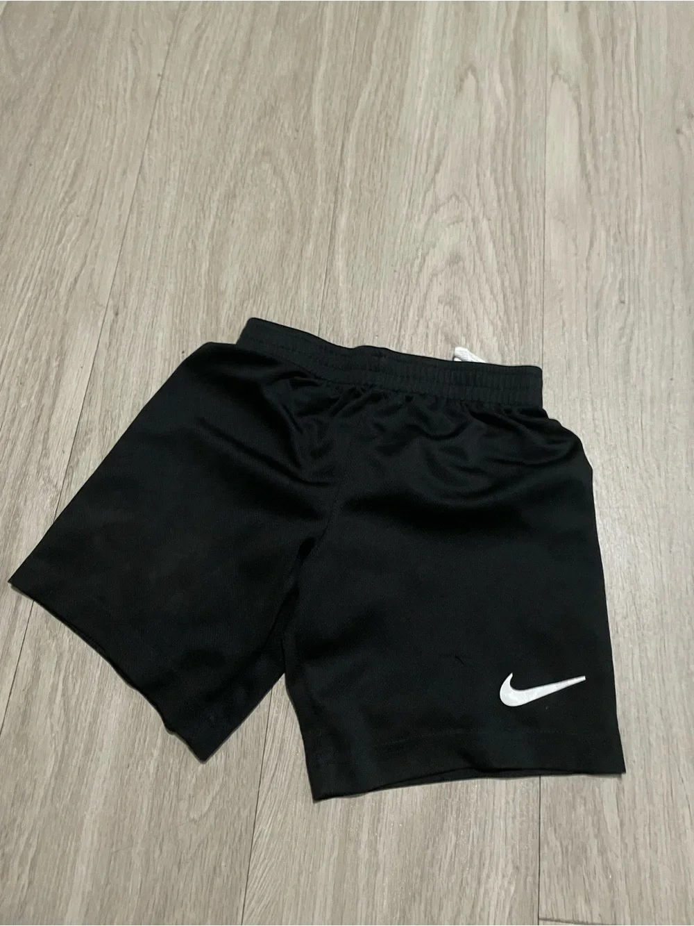 Nike Kids Black Shorts with White Swoosh